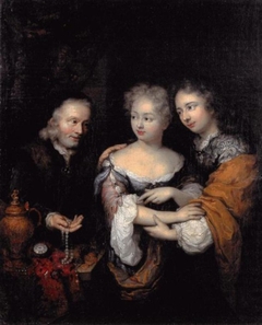 Old man offering a necklace to a young couple by Caspar Netscher