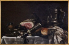 Still life with a ham, a Jan Steen jug, mustard jar and silver cup by Pieter Claesz