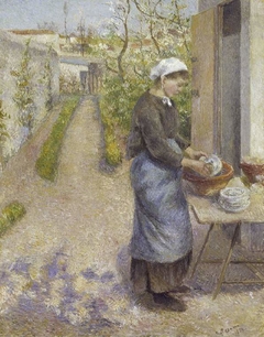 In the Garden at Pontoise:  A Young Woman Washing Dishes by Camille Pissarro