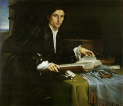 Portrait of a gentleman in his studio by Lorenzo Lotto