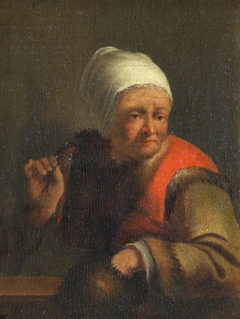 An Old Lady holding a Fur Muff and Spectacles by after Gerrit Dou