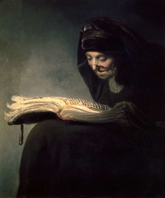 An old woman reading by Rembrandt