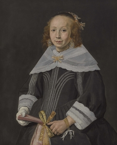 Portrait of a young woman holding a fan by Jan Hals