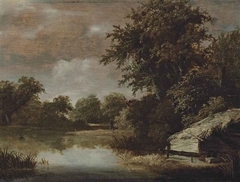 A wooded, river landscape with a thatched shed by Meindert Hobbema