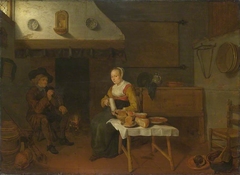 An Interior, with a Man and a Woman seated by a Fire by Quirijn van Brekelenkam