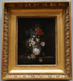 Flowers in a glass vase on a marble slab by Jan van Huysum