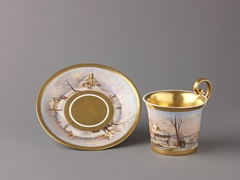 Cup and saucer with painted winter scenes by Anonymous