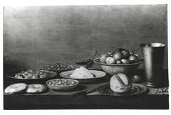 Fruit still life with silver beaker by Floris van Schooten