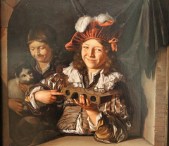 Two boys with a mouse trap and a cat at a window by Eglon van der Neer