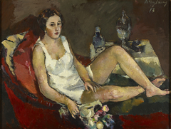 Junge Frau auf rotem Sofa by Anton Faistauer