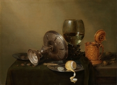 Still life with a gilded beer tankard by Willem Claesz Heda