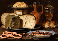 Still life with cheese, bread and drinking vessels by Clara Peeters