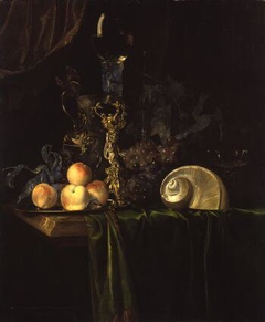 Still life with luxury vessels and fruits on a dark table cloth by Willem van Aelst