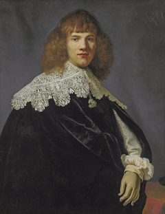 Portrait of a gentleman, half-length, in a black velvet cloak and white lace collar and cuffs by Anonymous