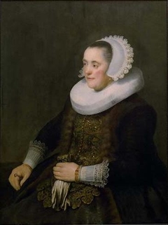 Portrait of a Woman holding Gloves by Rembrandt