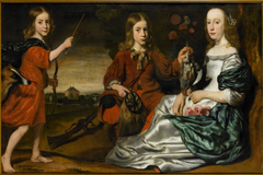 Group portrait of a young woman and two boys, dressed as hunters, in a landscape by follower of Nicolaes Maes