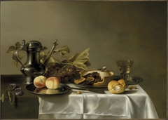 Still life with Jan Steen pitcher, peaches, pie, spoon, bread, and berkemeyer by circle of Pieter Claesz