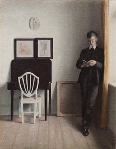 Interior with a Young Man Reading