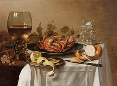 A still life with a roemer, a crab and a peeled lemon by Pieter Claesz