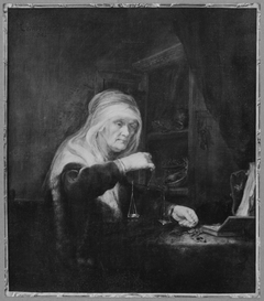 A Woman weighing Gold by Rembrandt