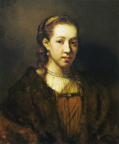 Half length figure of a woman in fanciful costume by Rembrandt